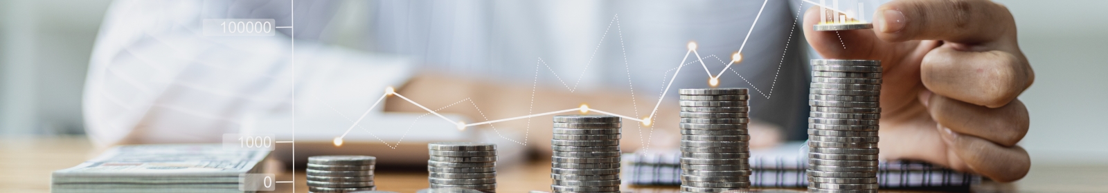 professional stacking coins with an overlay of a financial chart above the coins