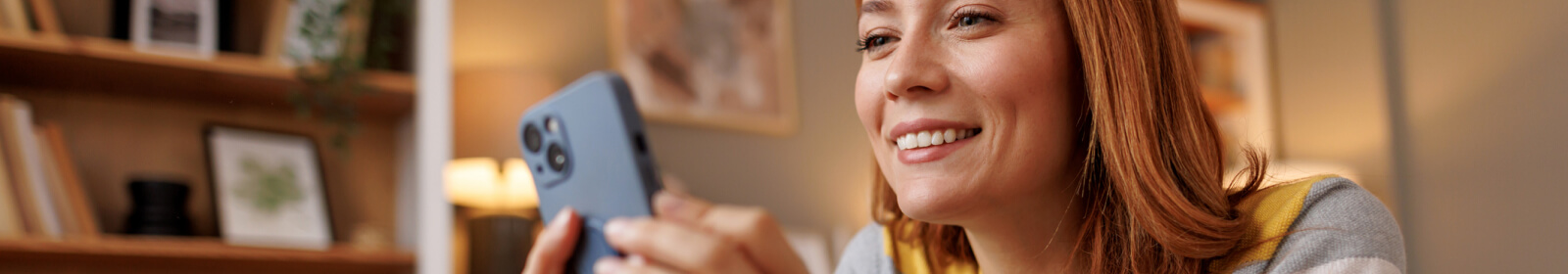 young woman looking at a smartphone