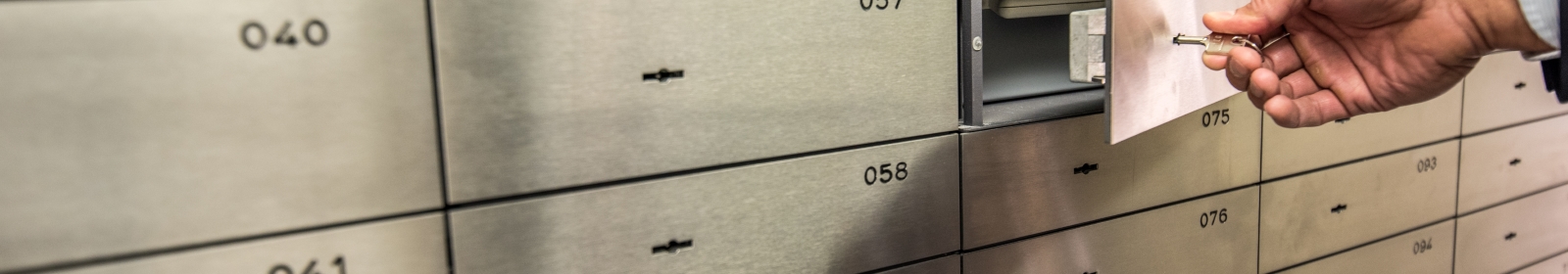 professional opening a bank safety deposit box